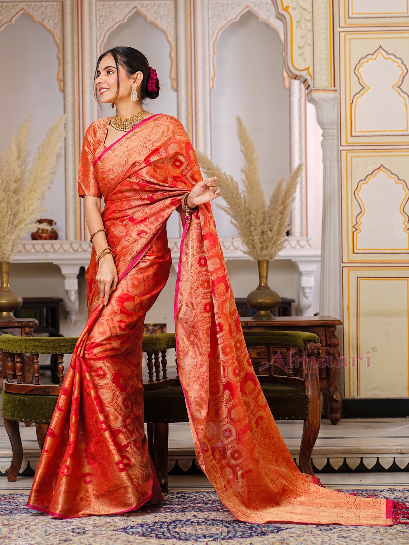 Red Color Pure Organza Saree Adorned with Zari Weaving, Complete with Matching Blouse Piece