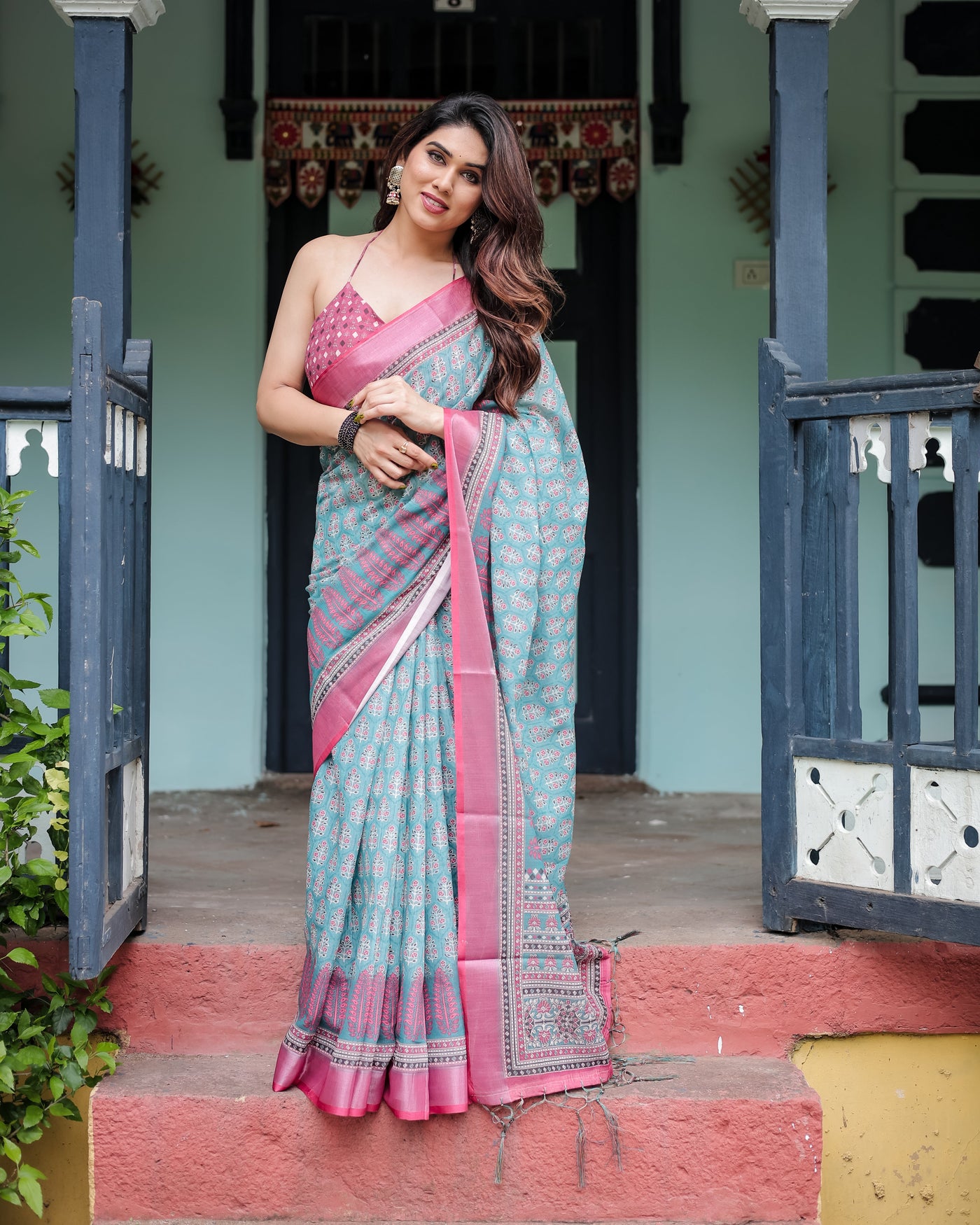 Aqua Blue Pure Cotton Linen Saree with Pink Border, Floral Motifs, and Tassel Detailing