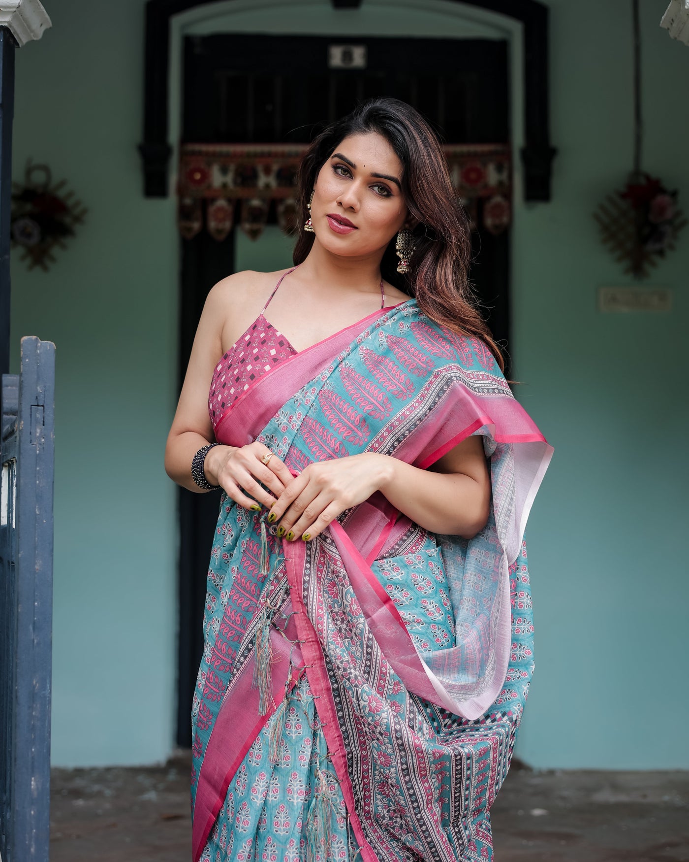 Aqua Blue Pure Cotton Linen Saree with Pink Border, Floral Motifs, and Tassel Detailing