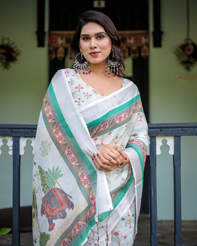 Ivory Pure Cotton Linen Saree with Elephant Motif and Floral Pattern, Green and Pink Borders, and Tassels on Edges.