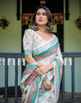 Ivory Pure Cotton Linen Saree with Elephant Motif and Floral Pattern, Green and Pink Borders, and Tassels on Edges.