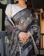 Black and White Pure Cotton Linen Saree with Intricate Floral Design and Tassels on Edges