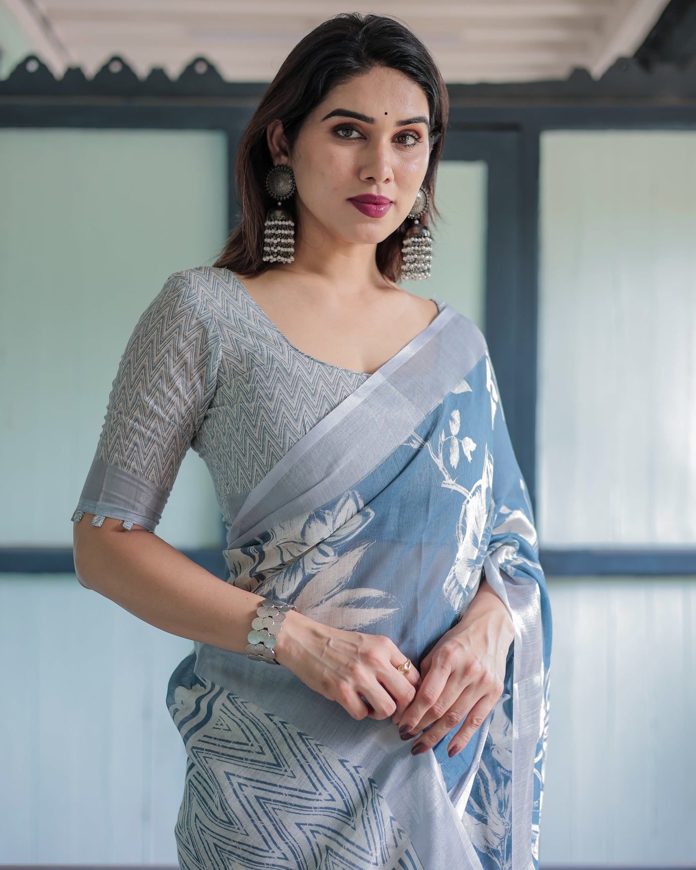 Pastel Blue Floral and Geometric Printed Cotton Linen Saree with Blouse and Tassel Edges