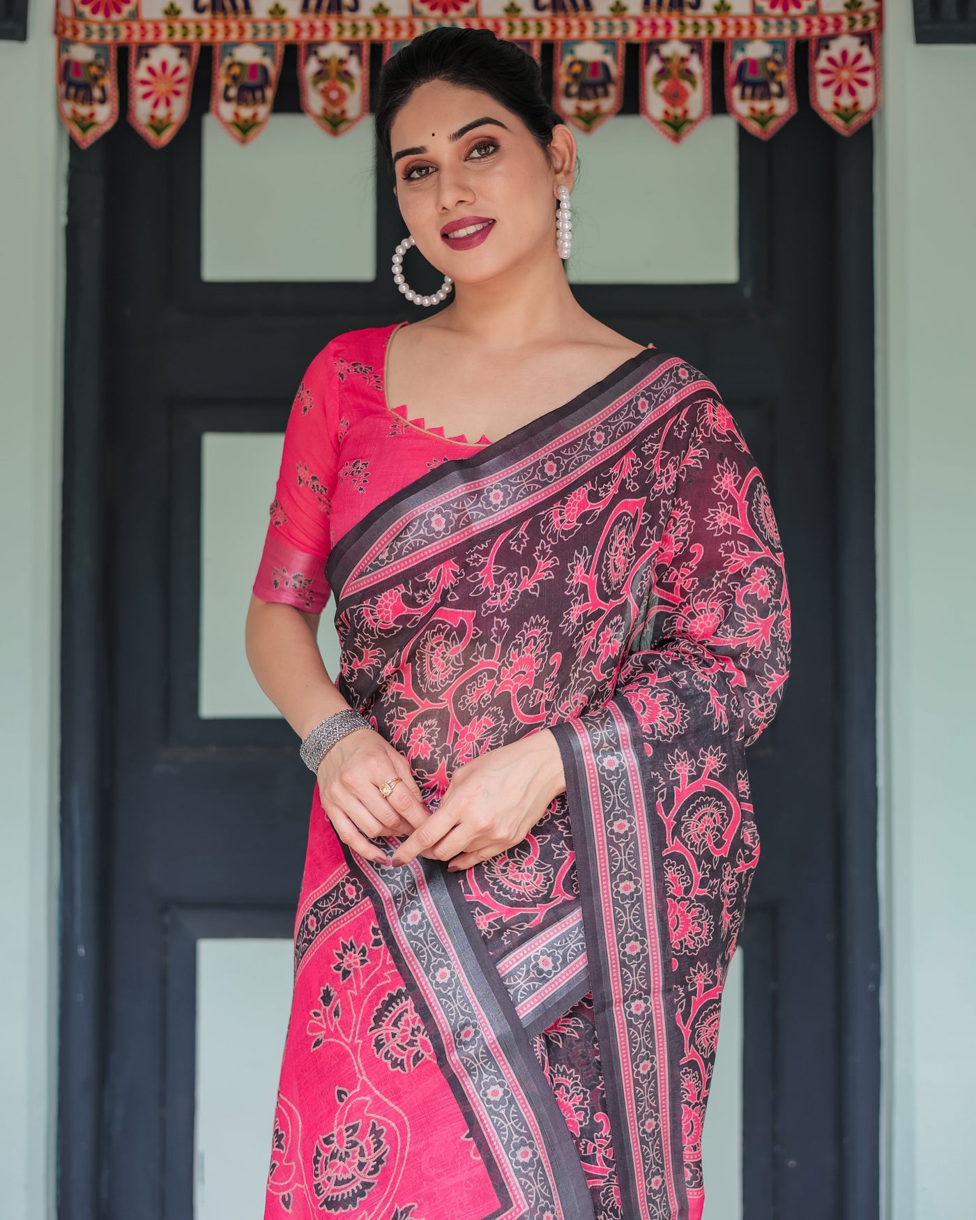 Pure Cotton Linen Saree in Black and Pink with Floral Print and Tassels