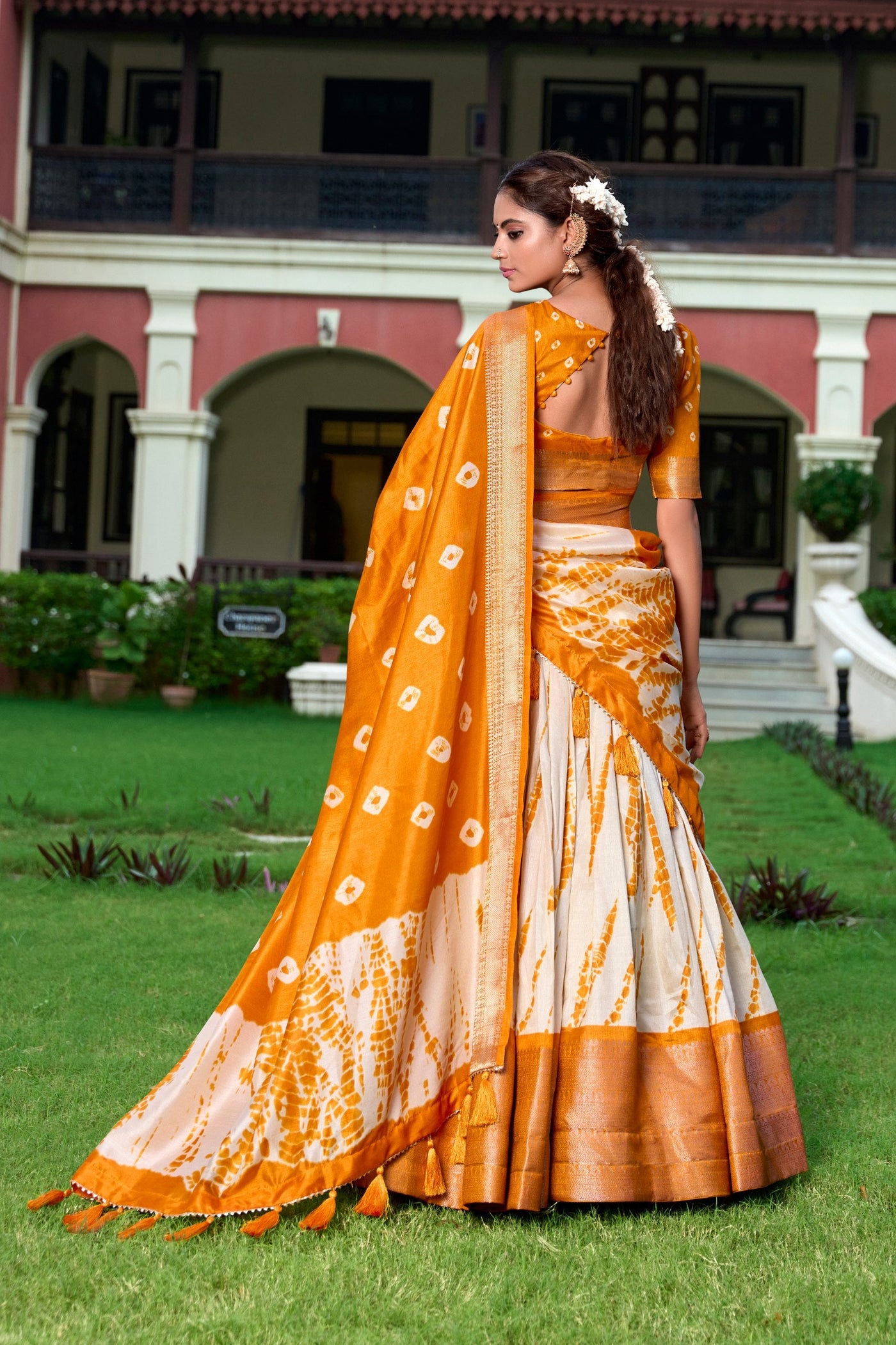 Orange & Ivory Shibori Print Dola Silk Lehenga Choli with Zari Weaving Border & Tassel Dupatta