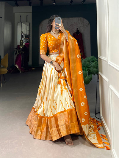 Orange & Ivory Shibori Print Dola Silk Lehenga Choli with Zari Weaving Border & Tassel Dupatta