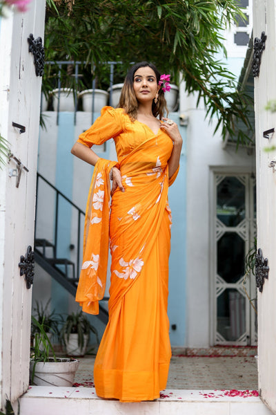 Sunset Orange Georgette Saree with Hand-Painted White Floral Motifs – Attached Blouse – 5.5 Meters
