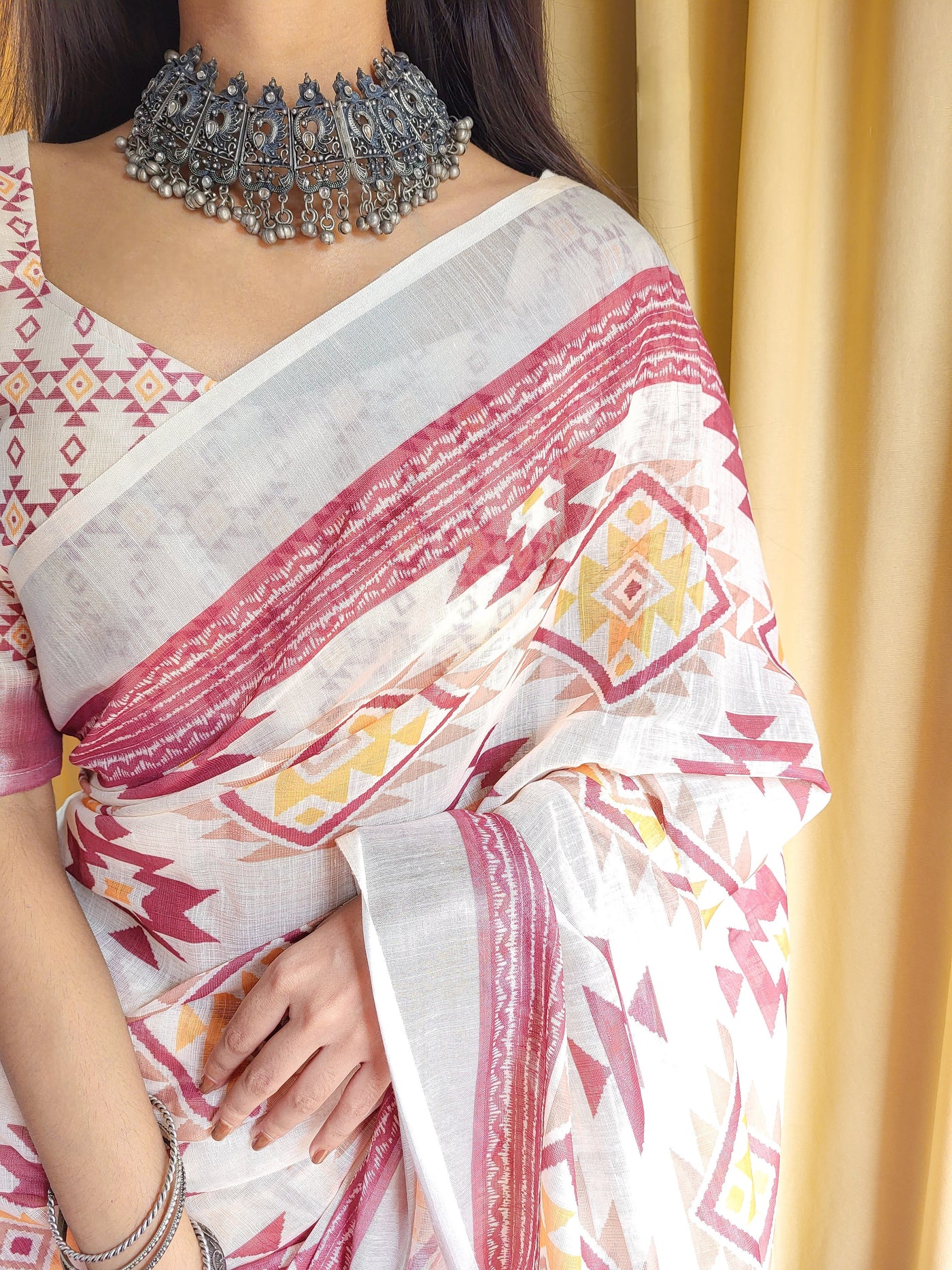 Ivory Linen Saree with Geometric Tribal Prints & Tassel Accents