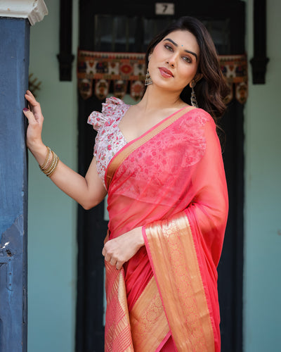 Vibrant Coral Pink Plain Chiffon Saree with Gold Zari Border, Floral Ruffled Blouse & Tassel Detailing