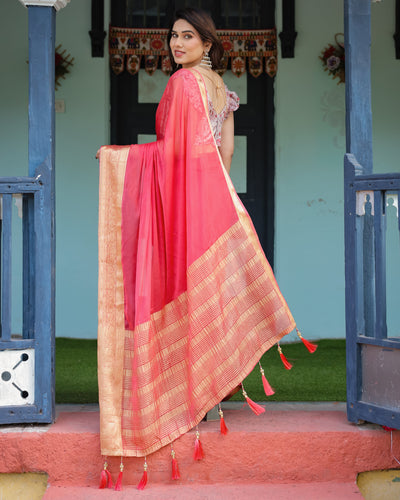 Vibrant Coral Pink Plain Chiffon Saree with Gold Zari Border, Floral Ruffled Blouse & Tassel Detailing