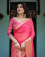 Ravishing Rani Pink Plain Chiffon Saree with Gold Zari Border, Floral Printed Blouse & Tassel Accents