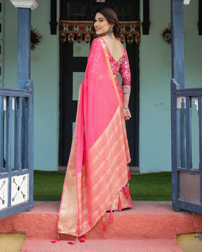 Ravishing Rani Pink Plain Chiffon Saree with Gold Zari Border, Floral Printed Blouse & Tassel Accents