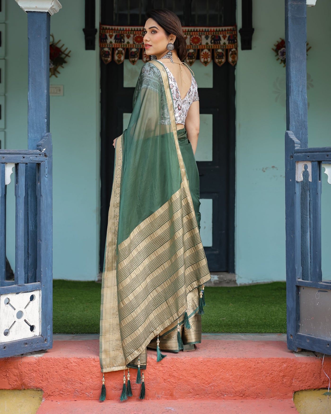 Elegant Bottle Green Plain Chiffon Saree with Gold Zari Border, Floral Printed Blouse & Tassel Finishing