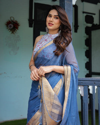 Serene Steel Blue Plain Chiffon Saree with Gold Zari Border, Floral Printed Blouse & Tassel Detailing