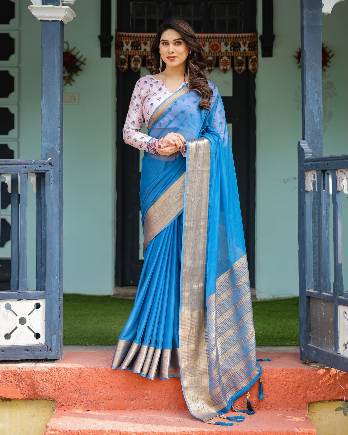 Vibrant Sky Blue Plain Chiffon Saree with Gold Zari Border, Floral Printed Blouse & Tassel Accents