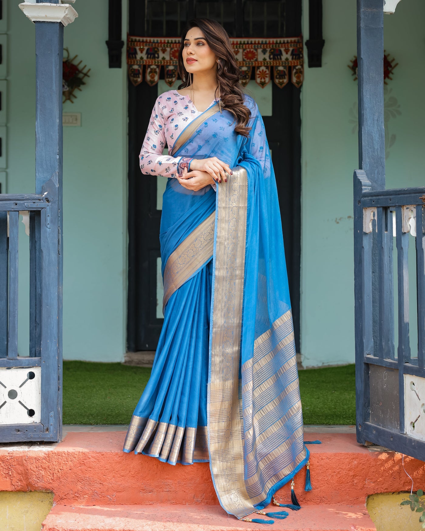 Vibrant Sky Blue Plain Chiffon Saree with Gold Zari Border, Floral Printed Blouse & Tassel Accents