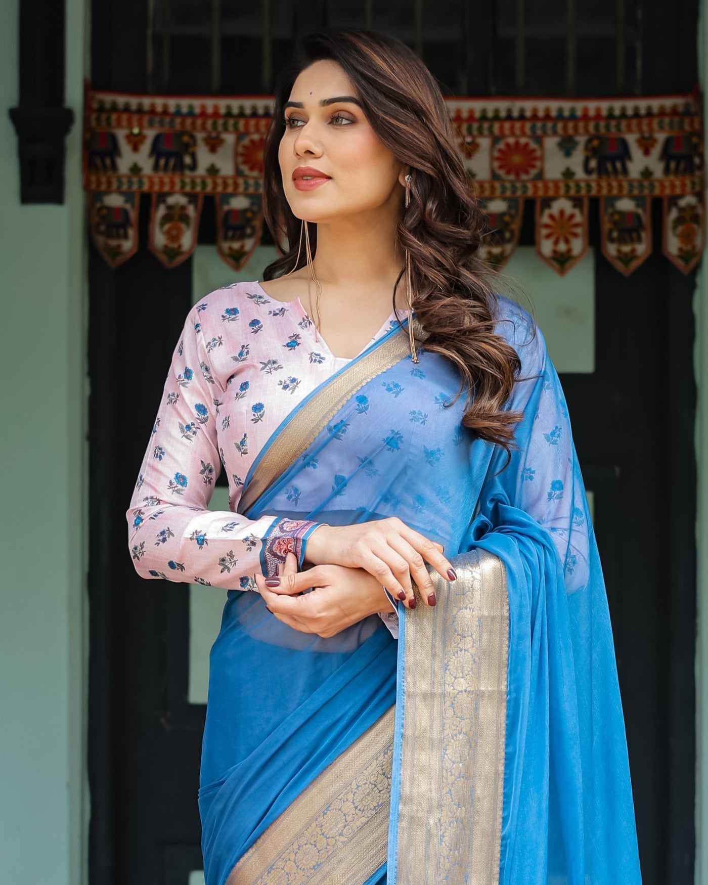 Vibrant Sky Blue Plain Chiffon Saree with Gold Zari Border, Floral Printed Blouse & Tassel Accents