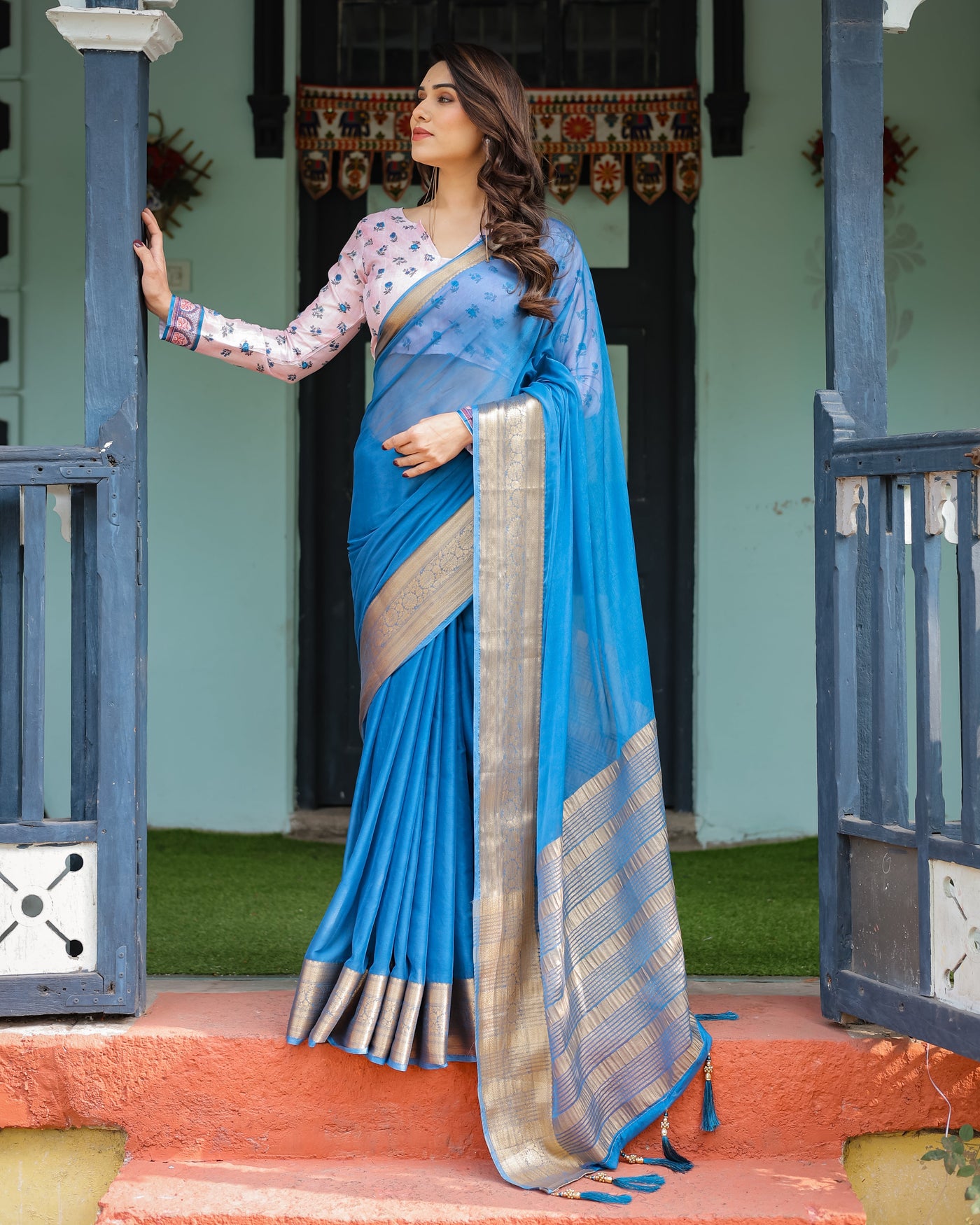 Vibrant Sky Blue Plain Chiffon Saree with Gold Zari Border, Floral Printed Blouse & Tassel Accents