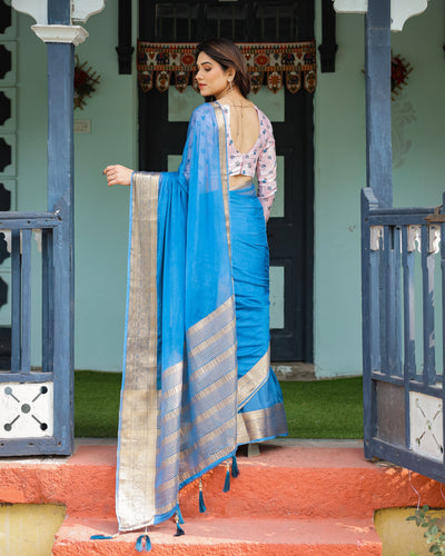 Vibrant Sky Blue Plain Chiffon Saree with Gold Zari Border, Floral Printed Blouse & Tassel Accents