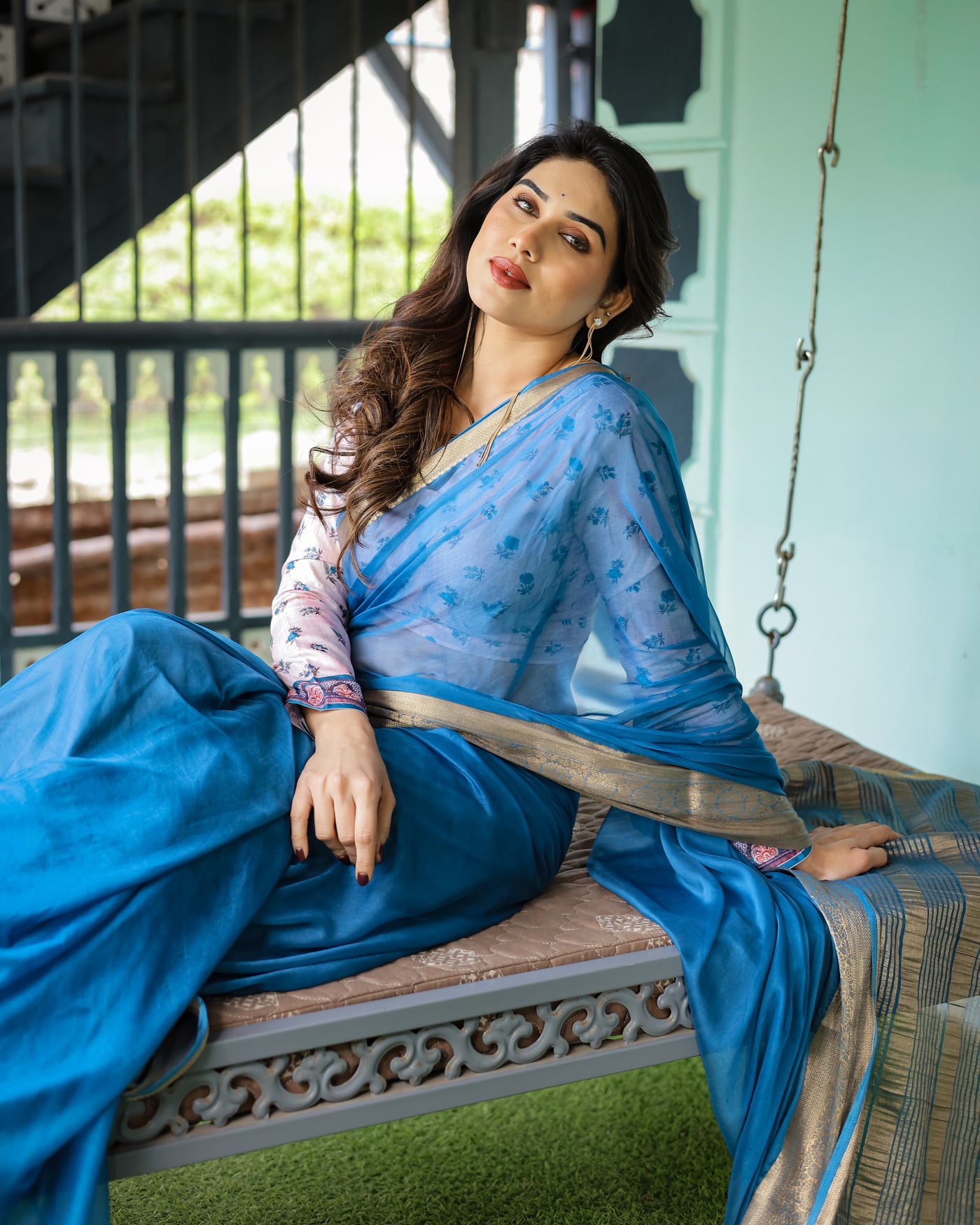 Vibrant Sky Blue Plain Chiffon Saree with Gold Zari Border, Floral Printed Blouse & Tassel Accents