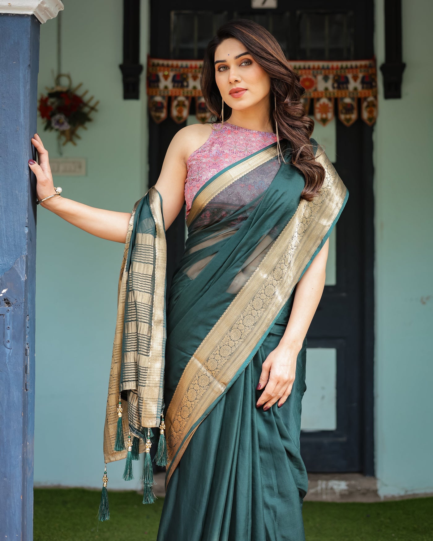 Enchanting Forest Green Plain Chiffon Saree with Gold Zari Border, Floral Printed Blouse & Tassel Details