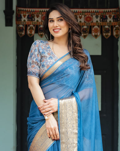 Vibrant Peacock Blue Plain Chiffon Saree with Gold Zari Border, Floral Printed Blouse & Tassel Accents