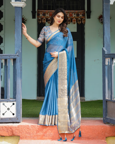 Vibrant Peacock Blue Plain Chiffon Saree with Gold Zari Border, Floral Printed Blouse & Tassel Accents