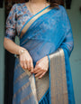 Vibrant Peacock Blue Plain Chiffon Saree with Gold Zari Border, Floral Printed Blouse & Tassel Accents