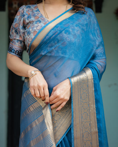 Vibrant Peacock Blue Plain Chiffon Saree with Gold Zari Border, Floral Printed Blouse & Tassel Accents