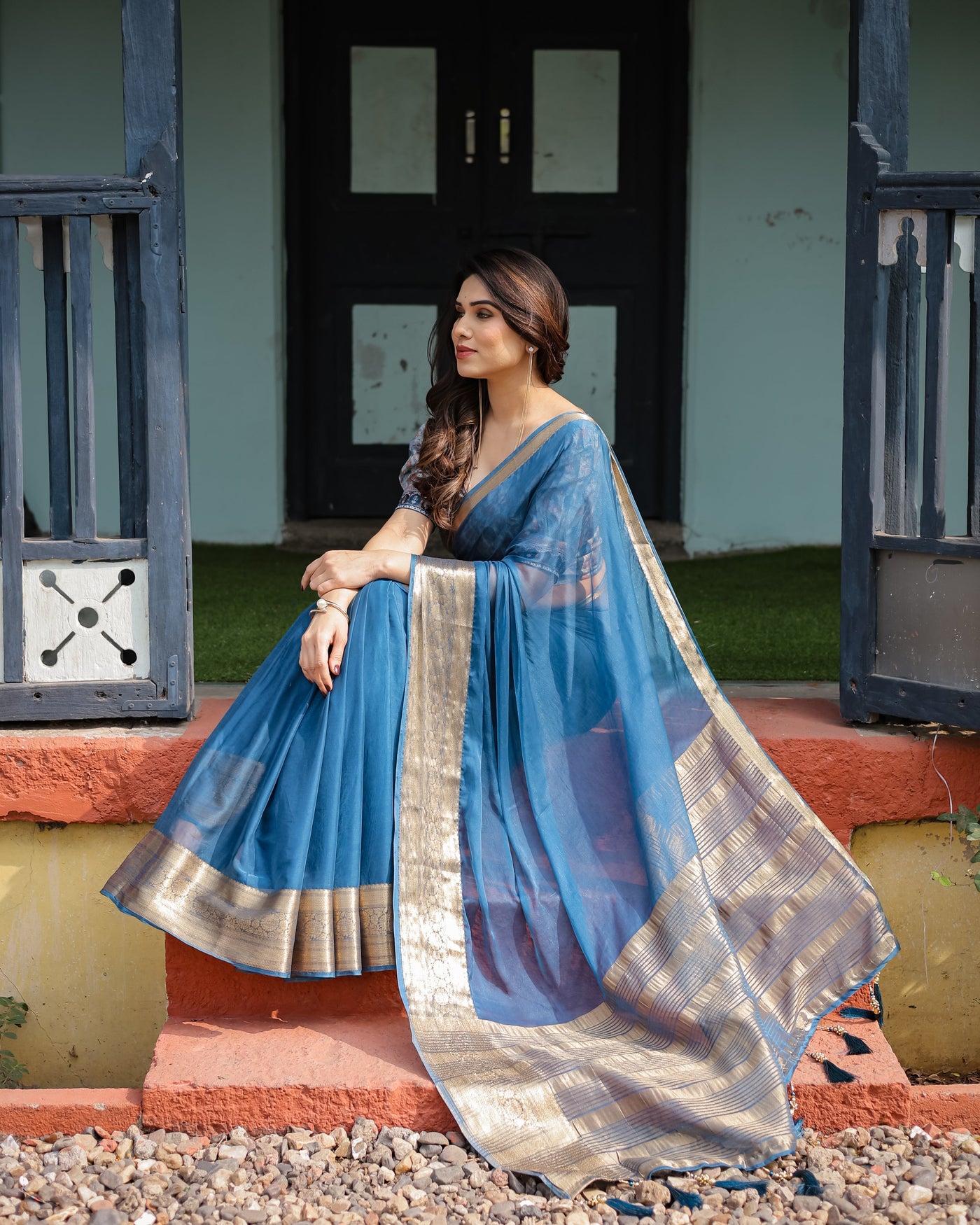 Vibrant Peacock Blue Plain Chiffon Saree with Gold Zari Border, Floral Printed Blouse & Tassel Accents