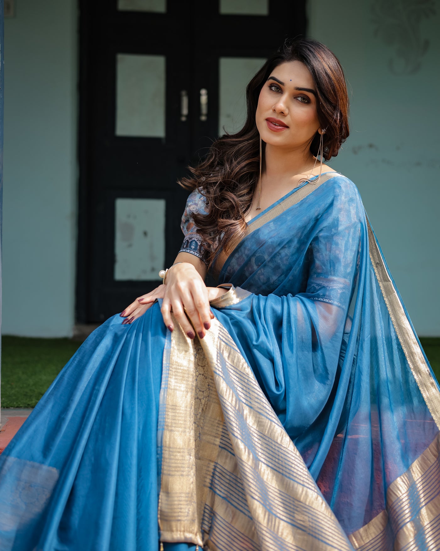 Vibrant Peacock Blue Plain Chiffon Saree with Gold Zari Border, Floral Printed Blouse & Tassel Accents