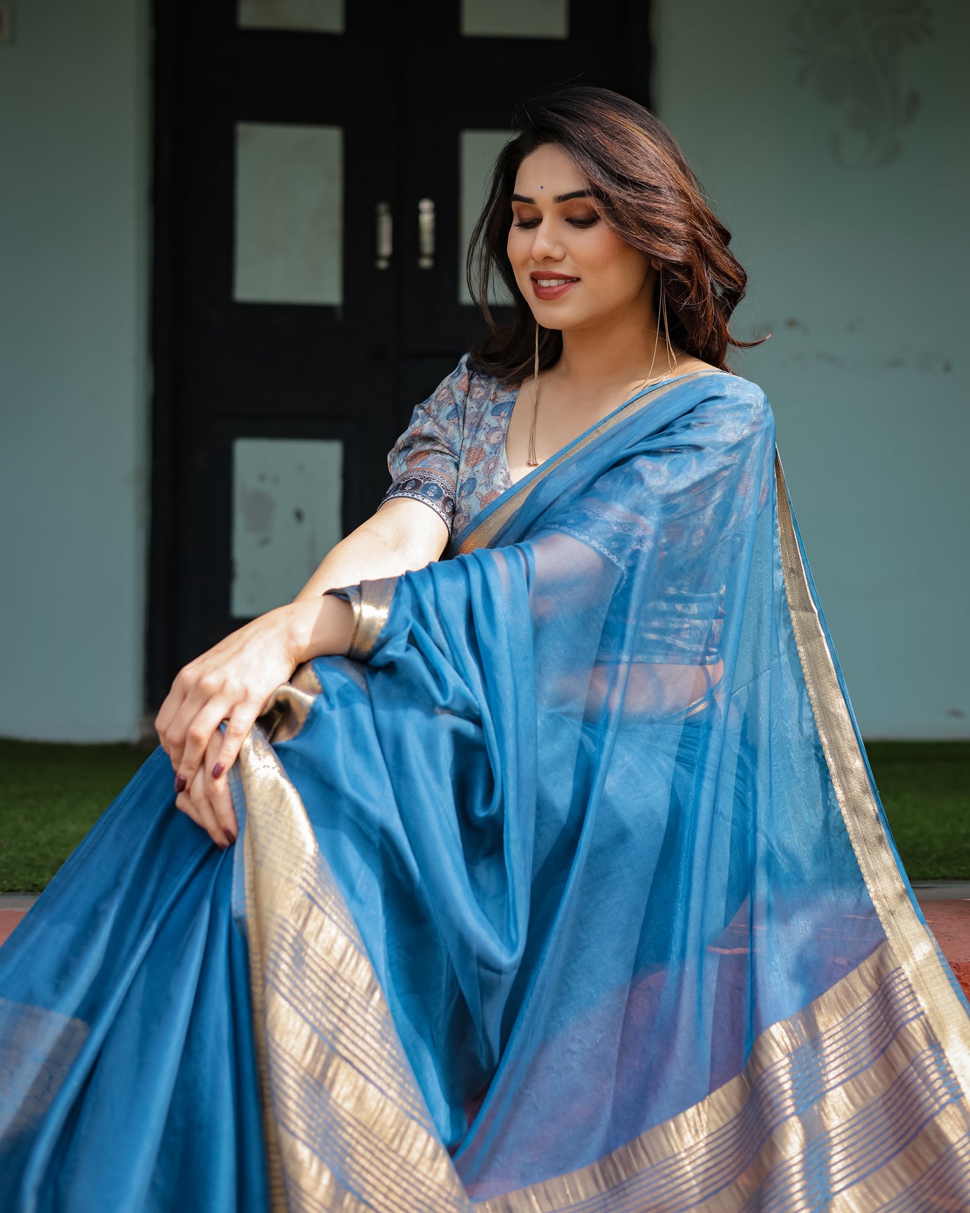 Vibrant Peacock Blue Plain Chiffon Saree with Gold Zari Border, Floral Printed Blouse & Tassel Accents