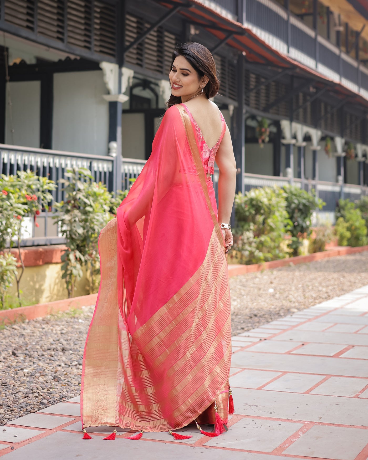 Flamingo Pink Plain Chiffon Saree with Gold Zari Border, Patterned Blouse & Tassel Detailing