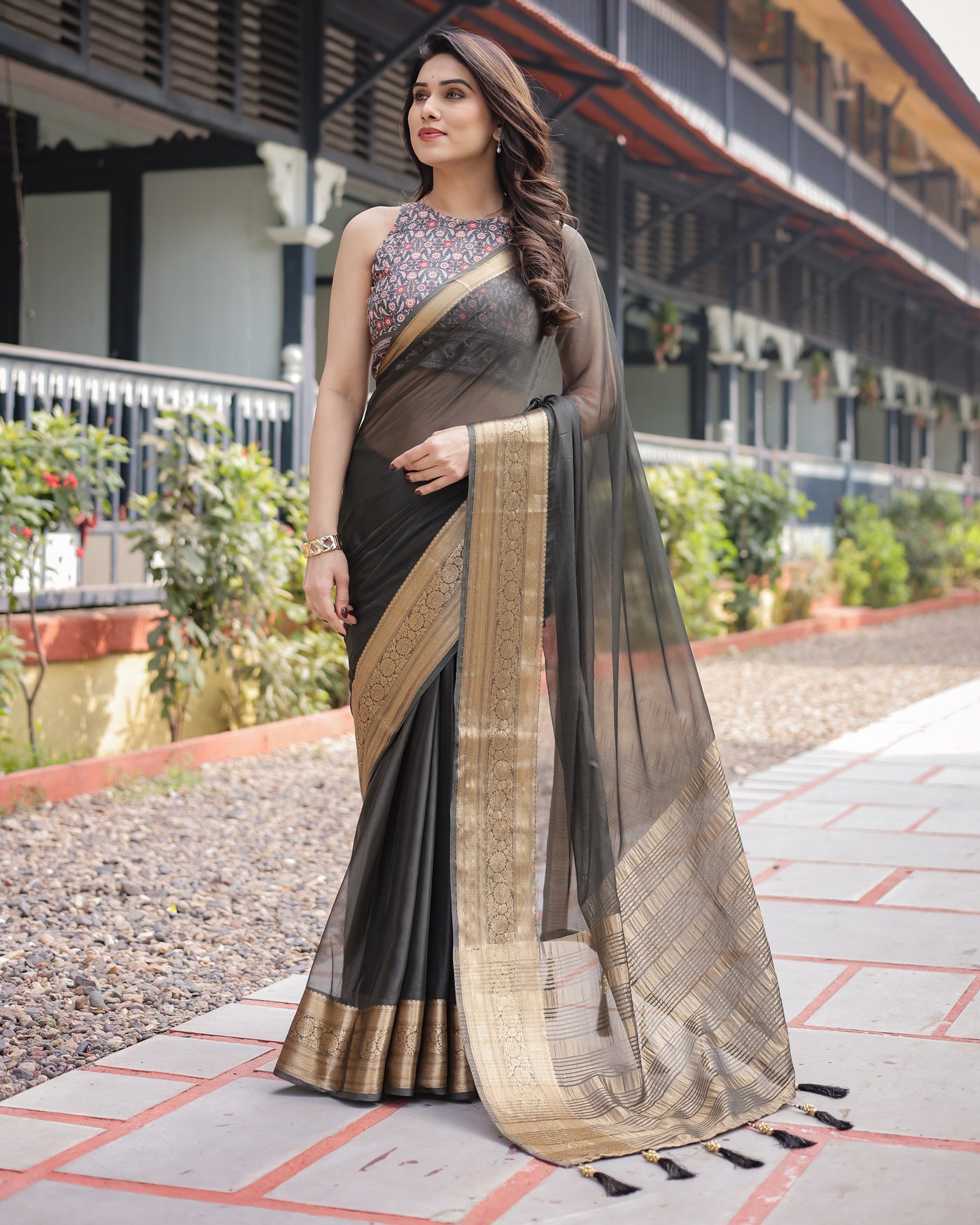 Ethereal Black Plain Chiffon Saree with Gold Zari Border, Floral Printed Blouse & Tassel Detailing