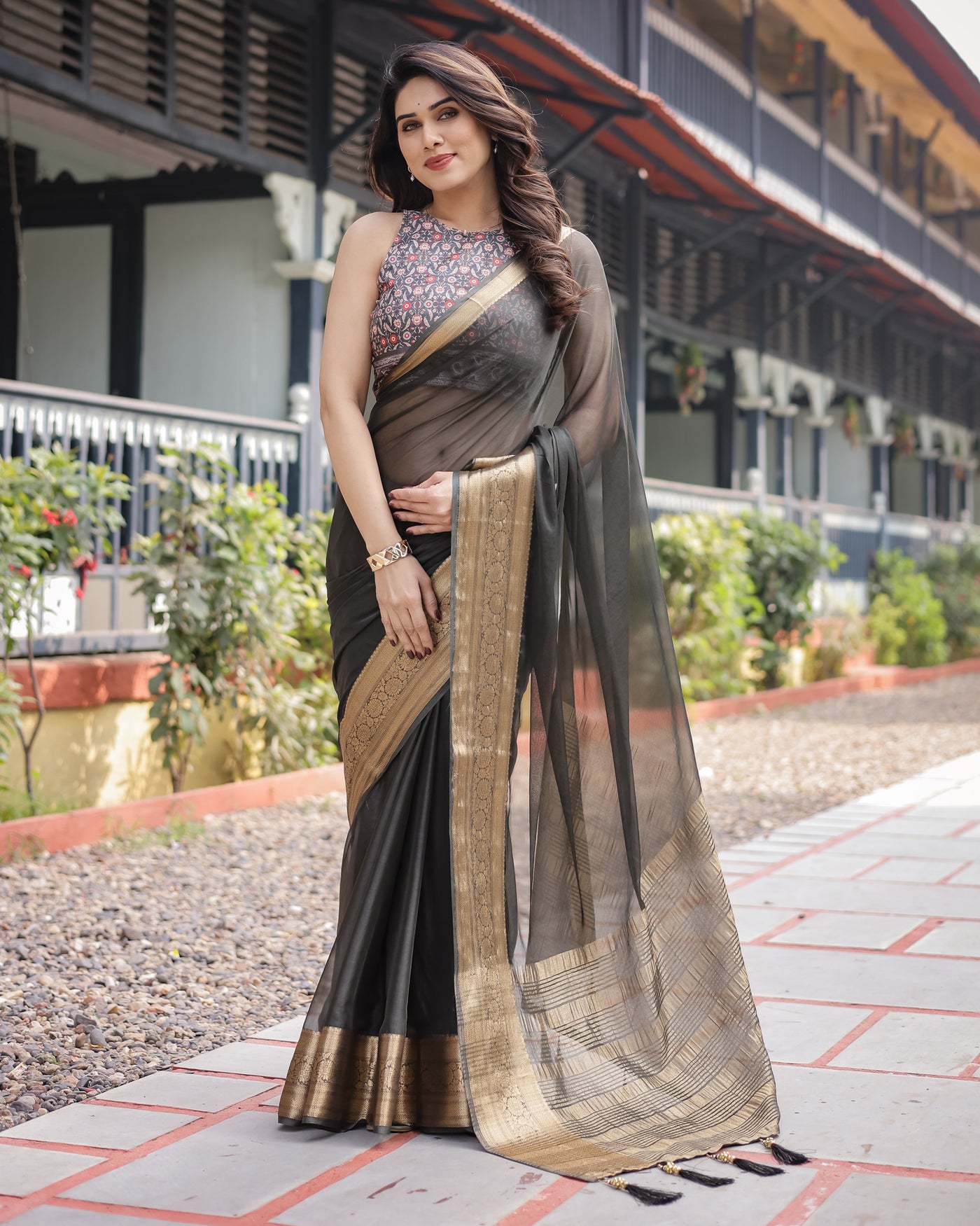 Ethereal Black Plain Chiffon Saree with Gold Zari Border, Floral Printed Blouse & Tassel Detailing