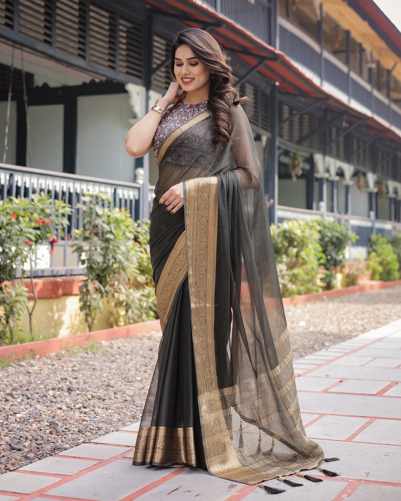 Ethereal Black Plain Chiffon Saree with Gold Zari Border, Floral Printed Blouse & Tassel Detailing