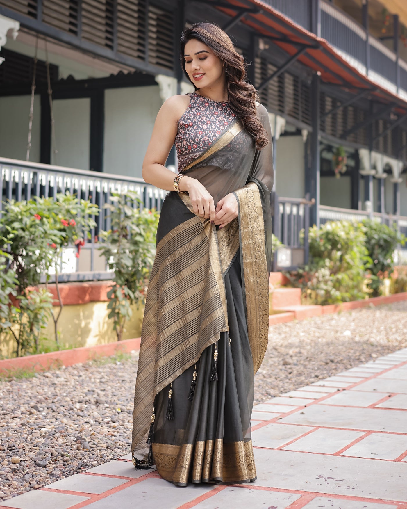 Ethereal Black Plain Chiffon Saree with Gold Zari Border, Floral Printed Blouse & Tassel Detailing