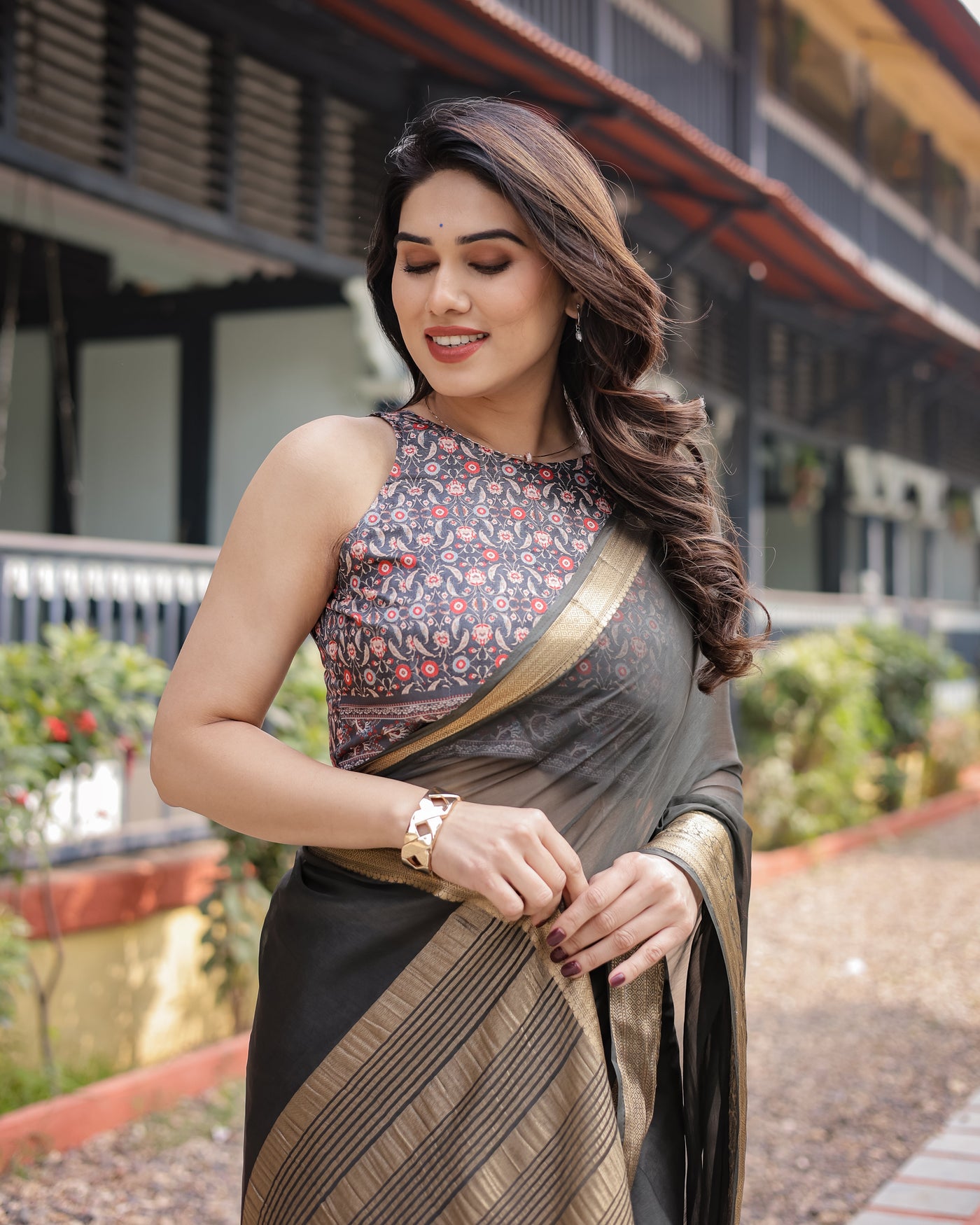 Ethereal Black Plain Chiffon Saree with Gold Zari Border, Floral Printed Blouse & Tassel Detailing