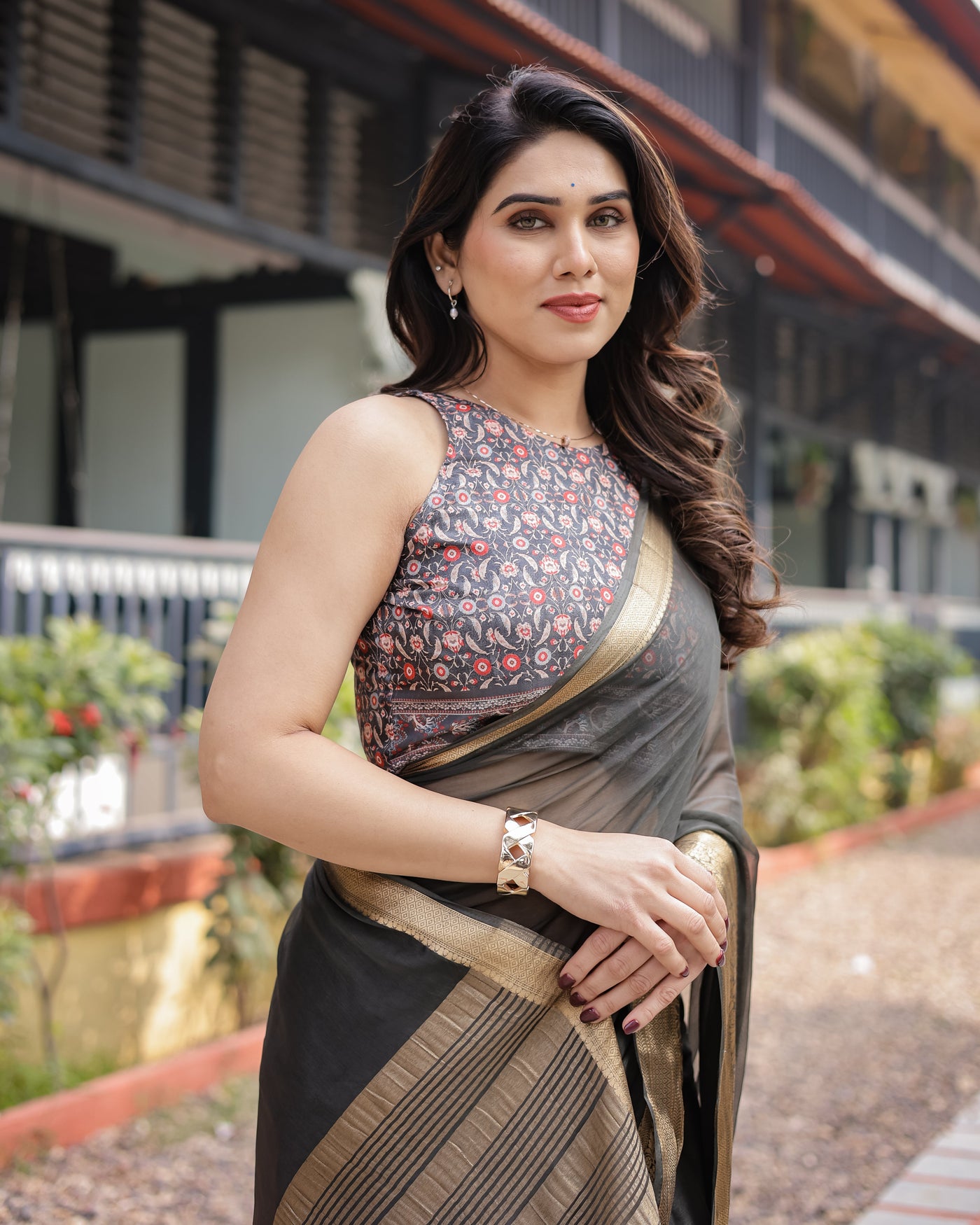 Ethereal Black Plain Chiffon Saree with Gold Zari Border, Floral Printed Blouse & Tassel Detailing