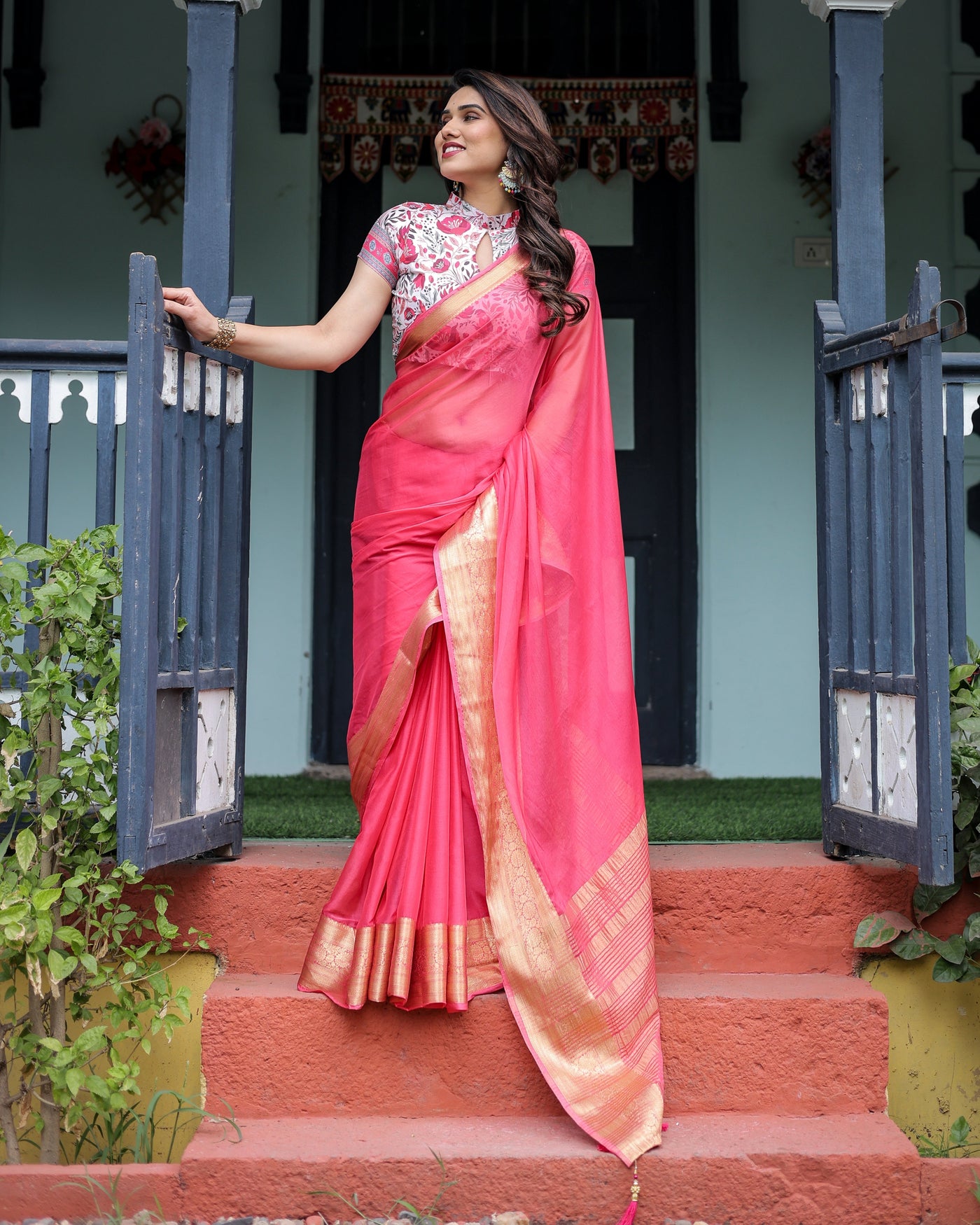 Raspberry Pink Plain Chiffon Saree with Gold Zari Border, High-Neck Floral Printed Blouse & Tassel Detailing