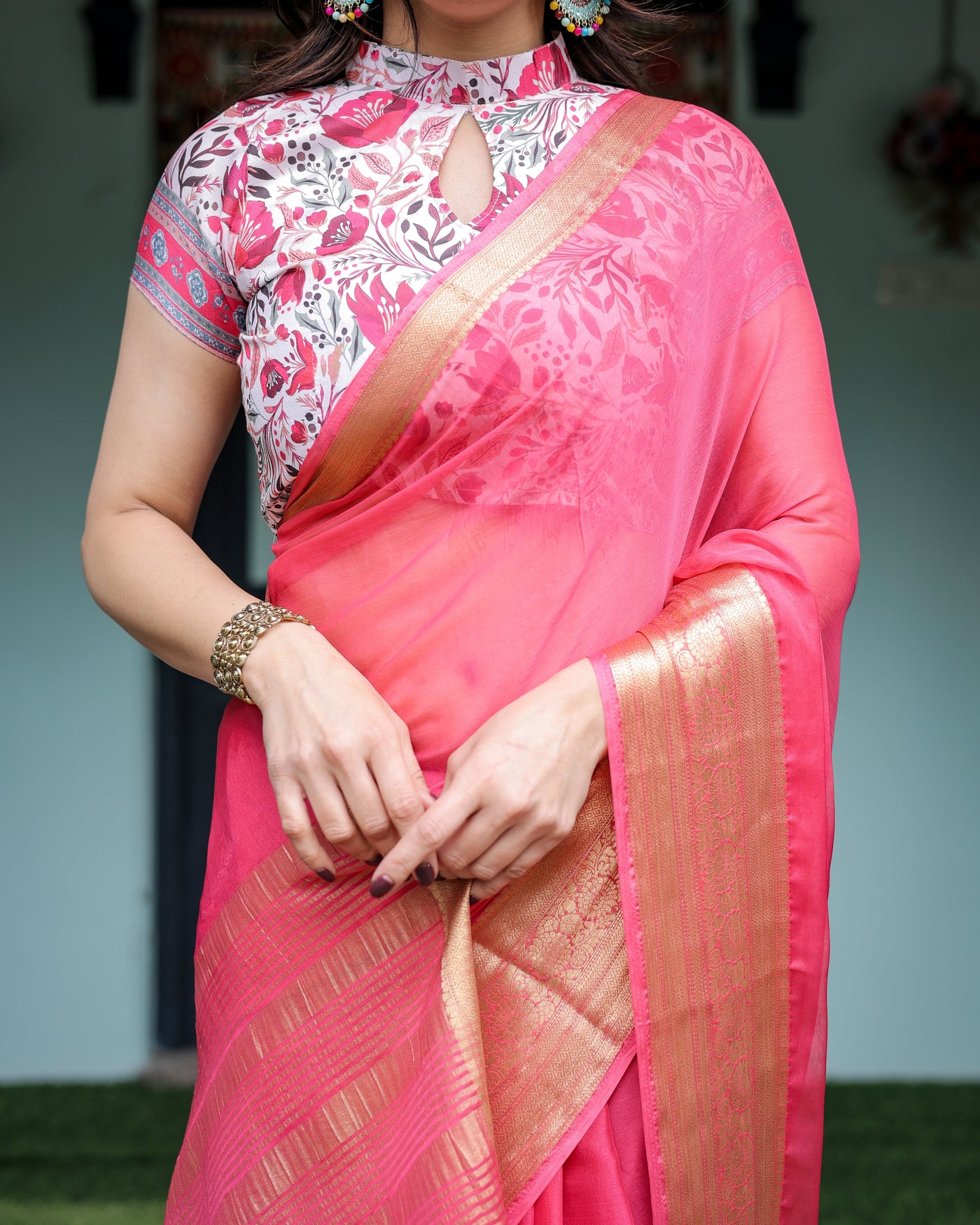 Raspberry Pink Plain Chiffon Saree with Gold Zari Border, High-Neck Floral Printed Blouse & Tassel Detailing