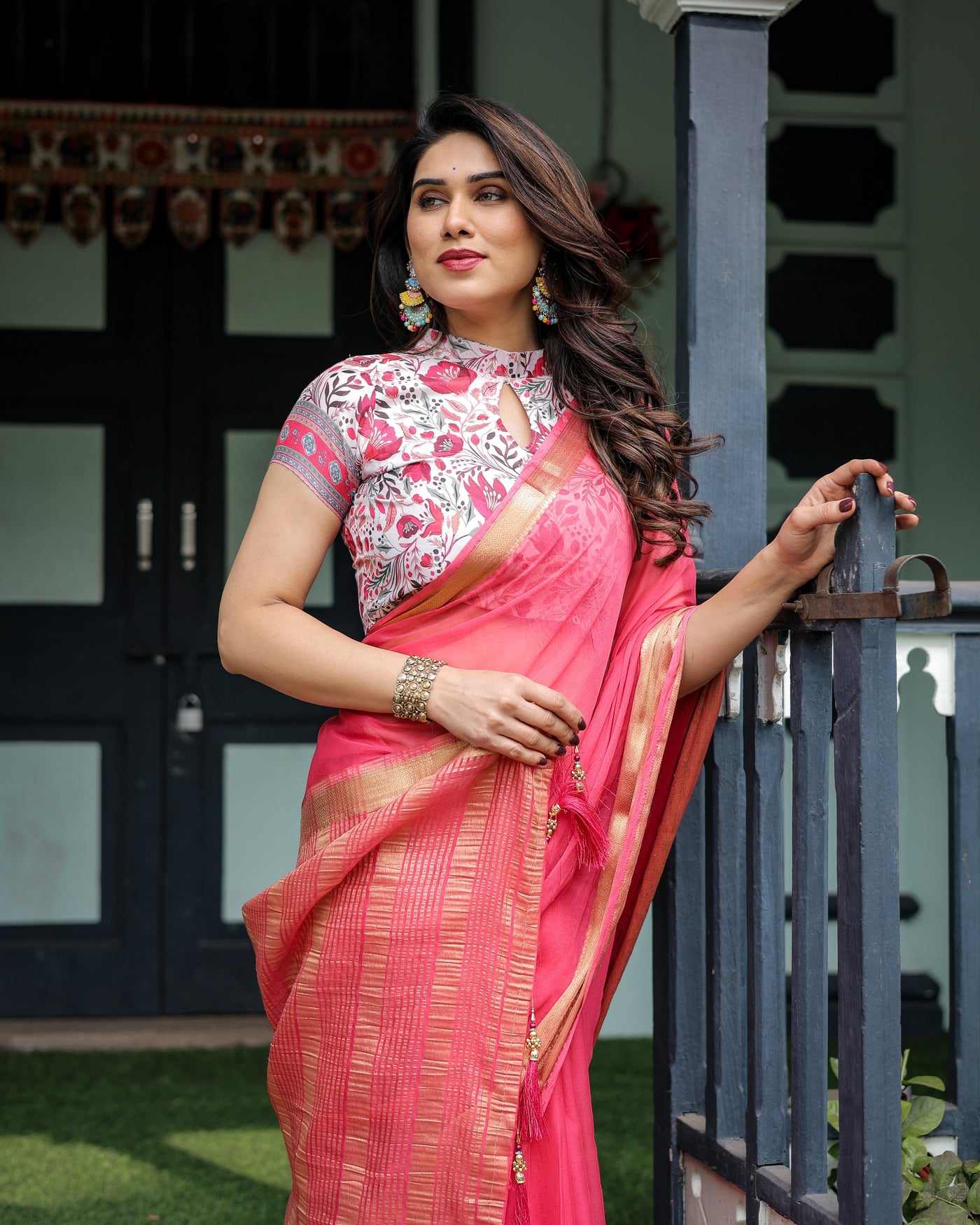 Raspberry Pink Plain Chiffon Saree with Gold Zari Border, High-Neck Floral Printed Blouse & Tassel Detailing