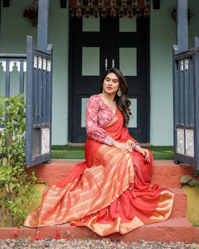 Fiery Red Plain Chiffon Saree with Gold Zari Border, Full-Sleeve Floral Blouse & Tassel Detailing