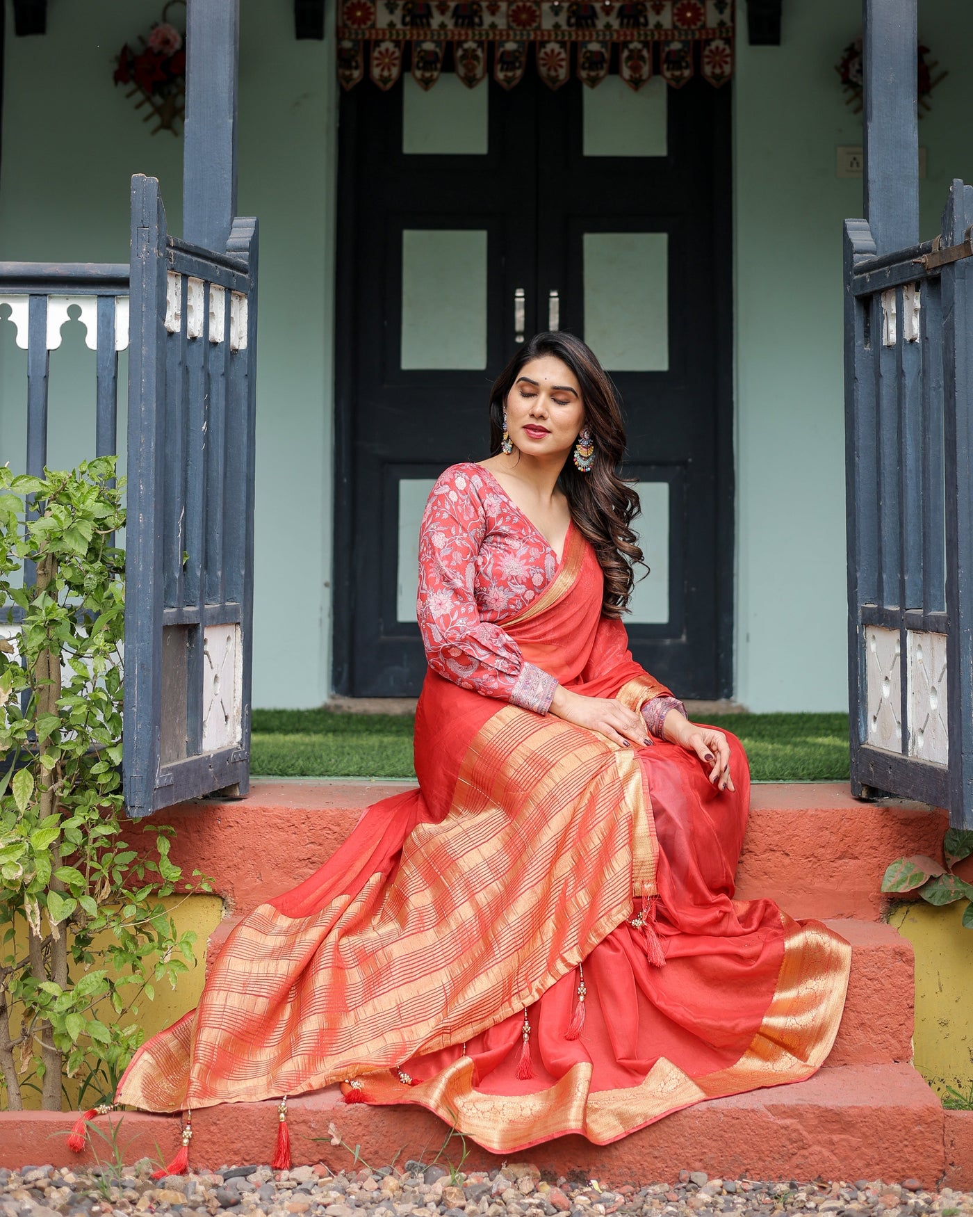 Fiery Red Plain Chiffon Saree with Gold Zari Border, Full-Sleeve Floral Blouse & Tassel Detailing