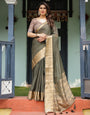 Elegant Olive Green Plain Chiffon Saree with Gold Zari Border, Floral Printed Blouse & Tassel Detailing