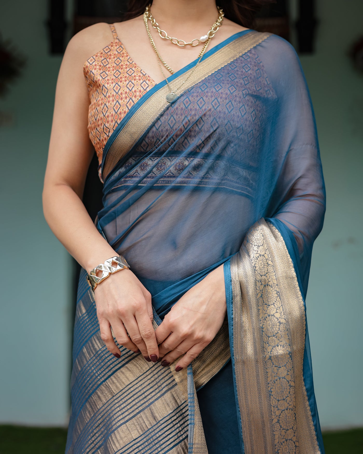 Teal Blue Plain Chiffon Saree with Gold Zari Border, Geometric Printed Blouse & Tassel Detailing