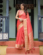 Graceful Coral Pink Plain Chiffon Saree with Gold Zari Border, Floral Embroidered Blouse & Tassel Detailing