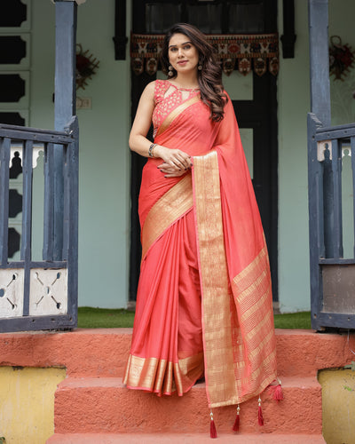 Graceful Coral Pink Plain Chiffon Saree with Gold Zari Border, Floral Embroidered Blouse & Tassel Detailing