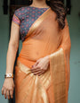 Elegant Tangerine Orange Plain Chiffon Saree with Gold Zari Border, Geometric Printed Blouse & Tassel Detailing