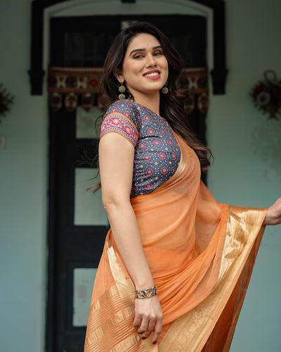 Elegant Tangerine Orange Plain Chiffon Saree with Gold Zari Border, Geometric Printed Blouse & Tassel Detailing